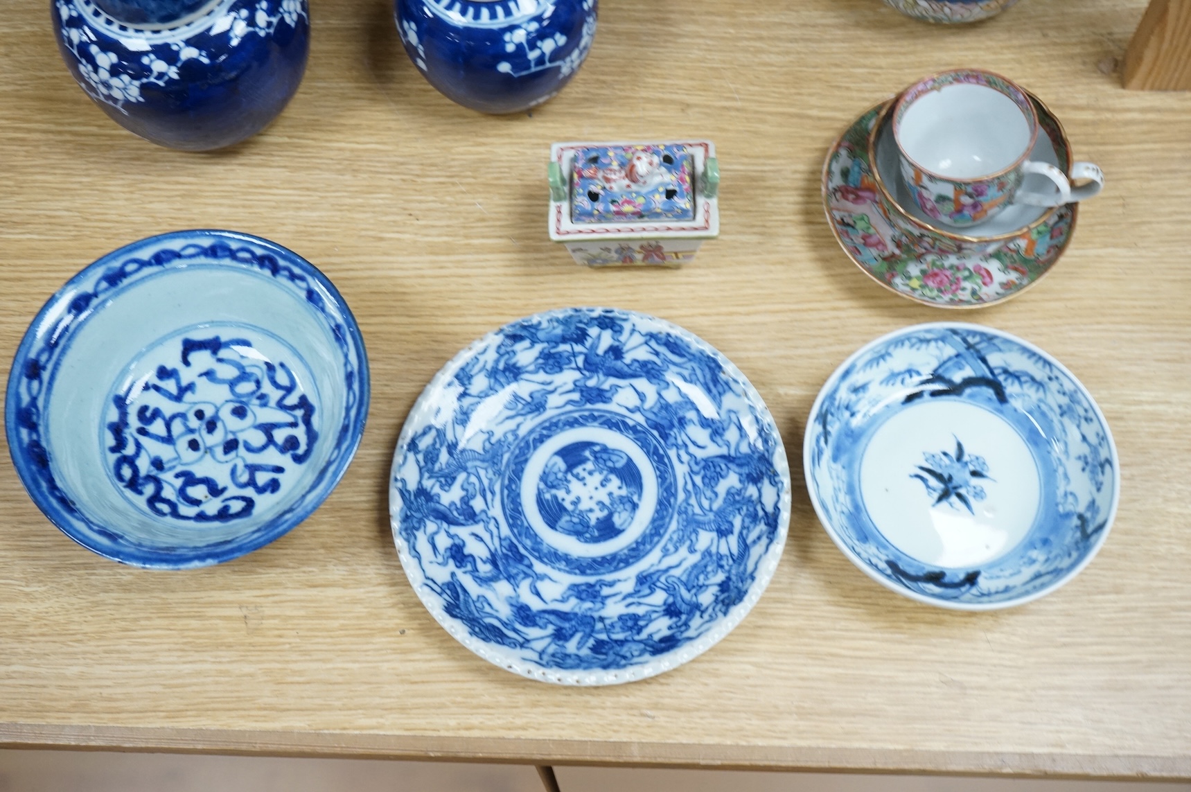 Fourteen pieces of Chinese porcelain and pottery, 19th/20th century to include a pair of blue and white ginger jars, famille rose cup and saucer and a cloisonné pot and cover in the form of an apple, largest 27cm high